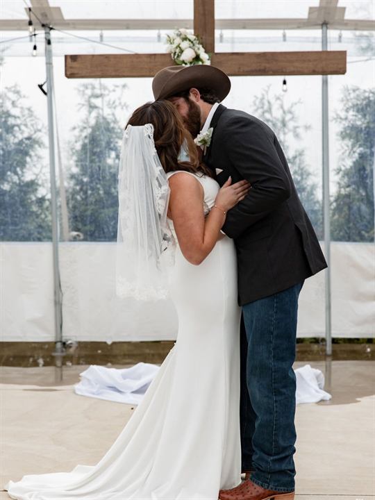 A couple share a quiet moment on their wedding day