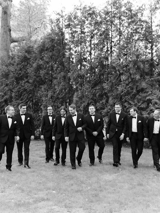 The groom and groomsmen in black and white