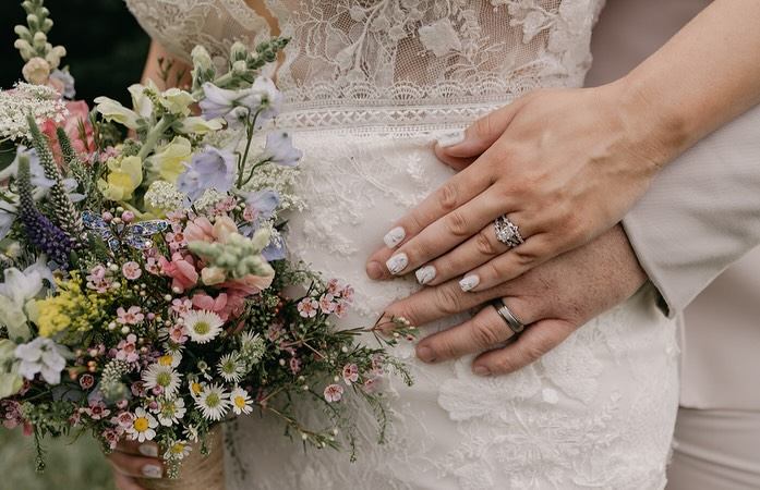 A couple shares a kiss on their wedding day